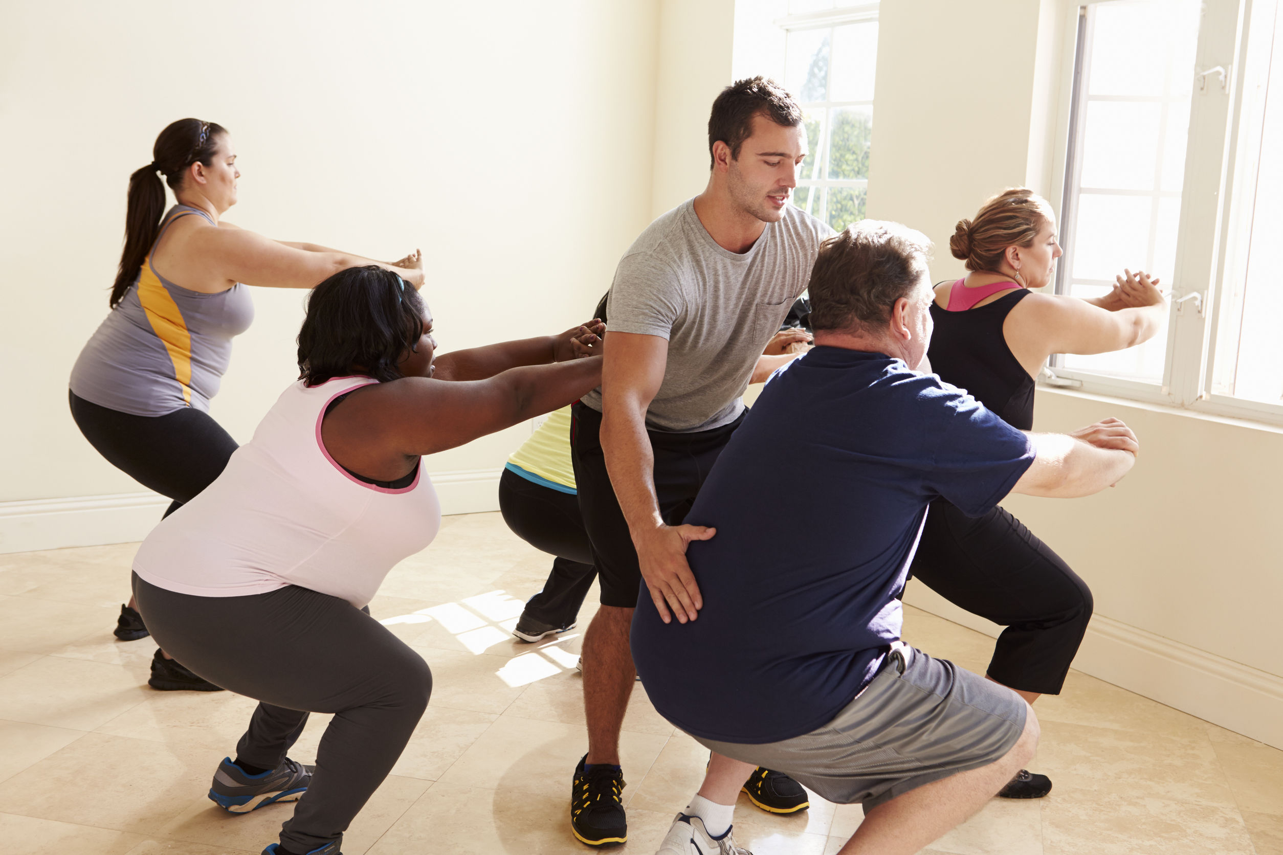 Exercise group class. https://www.info-on-high-blood-pressure.com/fitness-goals.html