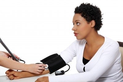 Woman checking her blood pressure. https://www.info-on-high-blood-pressure.com/cardiovascular-disease.html