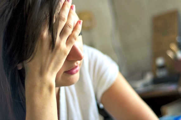 Woman holding her head.  https://www.info-on-high-blood-pressure.com/bloodpressuremedicationsideeffects.html